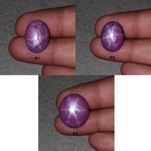 Peut inclure: Trois pierres précieuses de rubis étoilés violettes avec une étoile à six branches au centre. Les pierres précieuses sont de forme ovale et ont une surface lisse et polie. Les pierres précieuses sont étiquetées P1, P2 et P3.