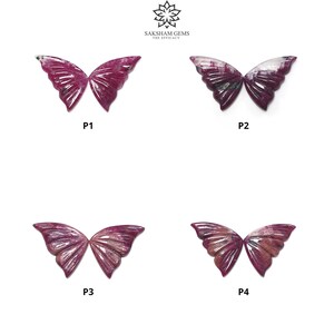 May include: Four butterfly-shaped gemstone carvings, each with a unique pattern of pink and white. The carvings are labeled P1, P2, P3, and P4.