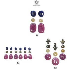 May include: A collection of faceted gemstones labeled S1, S2, and S3, featuring blue, yellow, and pink stones in various shapes including pear, round, and cushion cuts, arranged in sets with the Saksham Gems logo at the top center of the image.