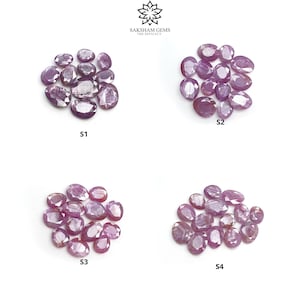 May include: Four groups of loose purple gemstones, labeled S1, S2, S3, and S4. Each group contains multiple oval-shaped gemstones.