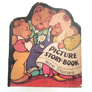 May include: A vintage children's picture story book with a colorful cover featuring three bears. The book is titled "Picture Story-Book Nine Stories" and has a signature on the bottom right corner.