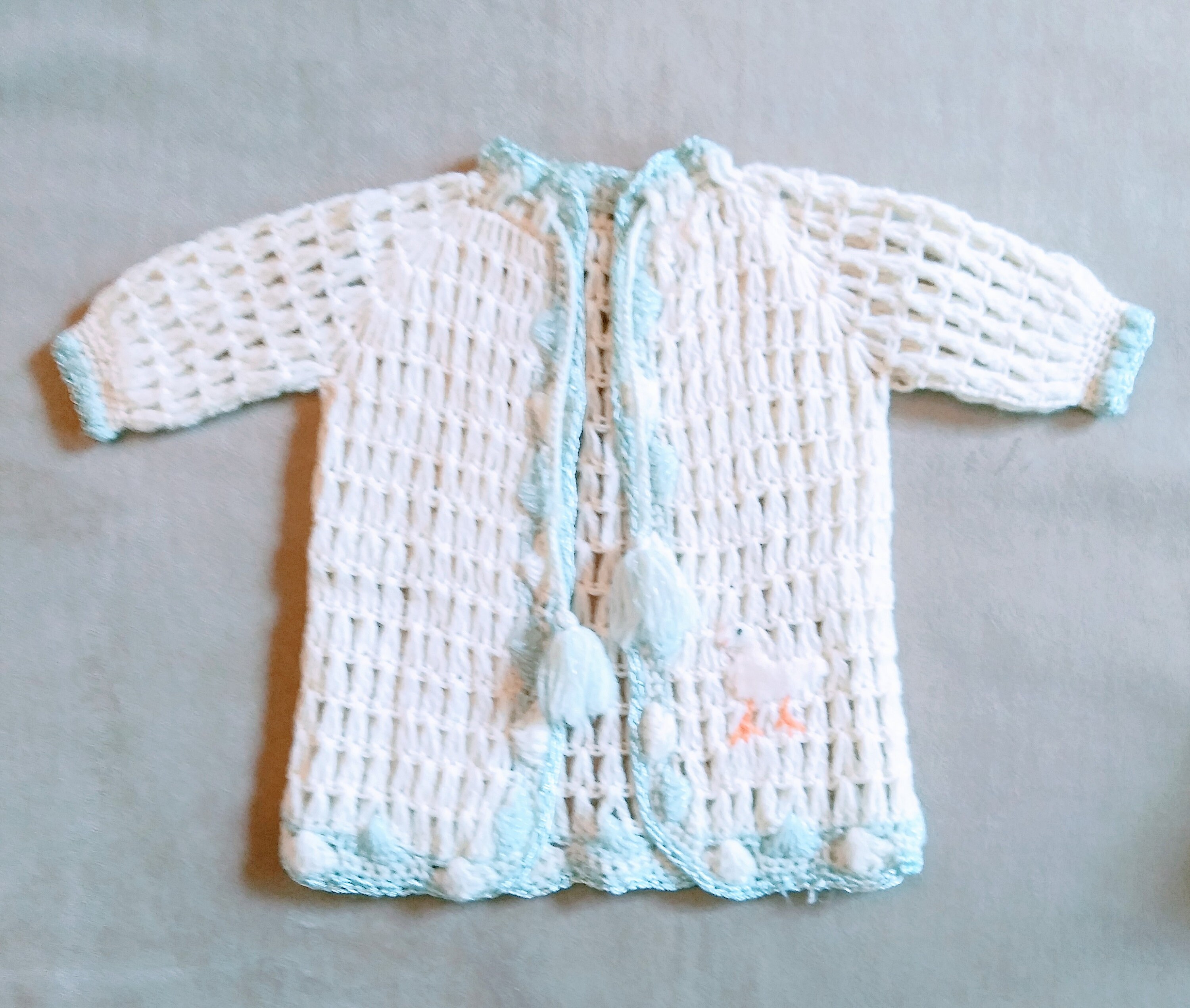 Knit Baby Sweater With Blue Tassel Ties 
