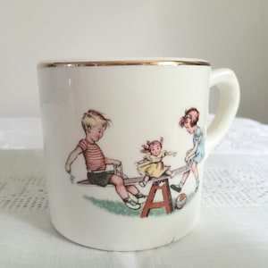 Vintage Children&#39;s Sturdy Porcelain Mug with Children at Play Seesaw Teetertotter Design with Gold Gilding Toddler Child Mug Cup 1950s