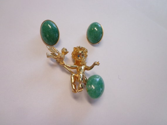Oleg Cassini Fairy Pixie Sitting on an Oval Stone