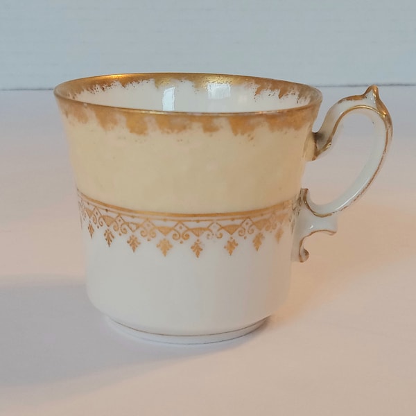 PHL Limoges Demitasse Teacup Embossed Butter yellow Gold Filigree and. Gold Gilt France