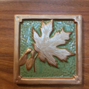 6 inch Maple Leaf Tile for fireplace or kitchen with green and copper glaze.