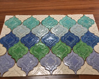 Tile mural kitchen backsplash. Blue, green turquoise and lavender glazes, Arabesque relief tile