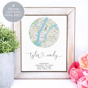 May include: A printable map of New York City with a red heart marking Central Park. The text "tyler & emily" is written in cursive script below the map. The text "ENGAGED JANUARY 20, 2019 CENTRAL PARK NEW YORK, NY" is printed below the names.