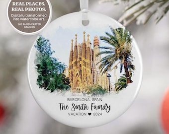 May include: A round white ceramic ornament featuring a watercolour illustration of the Sagrada Familia in Barcelona, Spain, with a palm tree and greenery. The text reads: BARCELONA, SPAIN, The Smith Family, VACATION 2024.