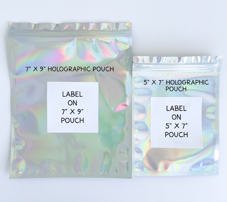May include: Two iridescent holographic pouches with white labels. The larger pouch is 7 inches by 9 inches and the smaller pouch is 5 inches by 7 inches. Both pouches have labels that say "LABEL ON" and the size of the pouch.