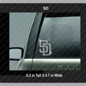 May include: A silver car window decal with a sparkling silver 'SD' logo. The decal is 6.2 inches tall and 4.7 inches wide.