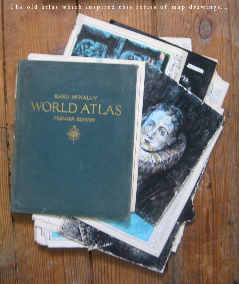 May include: A vintage green hardcover book titled "RAND MCNALLY WORLD ATLAS PREMIER EDITION" with a compass illustration on the cover. The book is stacked on top of other books and maps.