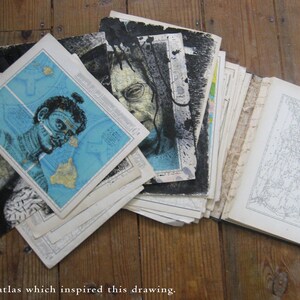May include: A vintage atlas with a map of the United States on the cover. The atlas is open to a page with a map of a tropical island. The atlas is surrounded by other pages, some of which are black and white and some of which are in color.