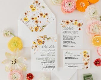 May include: A wedding invitation suite featuring a white envelope and cards with a sunflower and floral design. The suite includes an invitation, response card, and details card. The text includes names and wedding details.