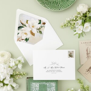 May include: A white envelope with a floral design on the flap. The envelope is addressed to Mr. and Mrs. Robert Dante, 287 Marguerite Parkway, Marina del Ray, California 00201.