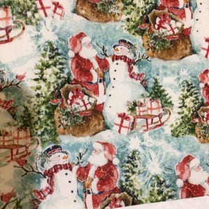 May include: A white fabric with a repeating pattern of Santa Claus and snowmen. Santa is wearing a red suit and a white beard. The snowmen are wearing black hats and scarves. The background is a blue and white winter scene with trees and snow.