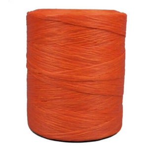 May include: A spool of bright orange yarn, perfect for crafting projects.