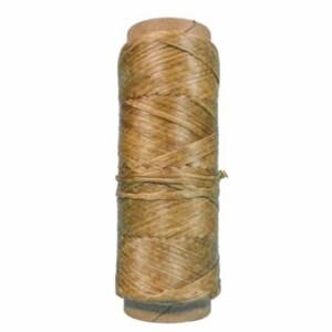 May include: A spool of natural-colored twine, tightly wound around a cardboard core. The twine has a woven texture and is secured with a single strand wrapped around the middle. The spool is cylindrical and stands upright against a white background.