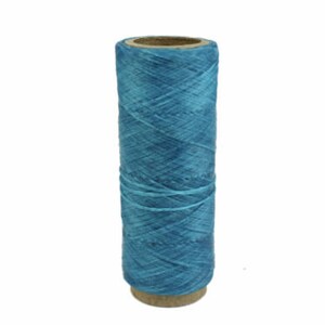 May include: A spool of blue waxed thread for leather crafting.