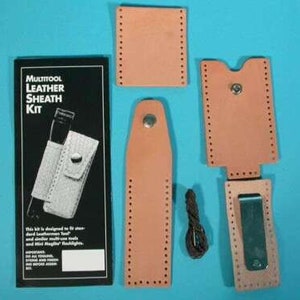 May include: A multitool leather sheath kit with instructions. The kit includes a brown leather sheath, a brown leather belt loop, and a brown leather strap. The kit is designed to fit standard Leatherman multi-tools and similar multi-use tools.