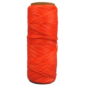 May include: A spool of bright orange yarn, wound tightly and ready for crafting projects.
