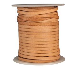 May include: A spool of tan leather cord, wound tightly and ready for crafting projects.