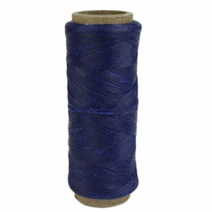May include: A spool of dark blue waxed thread for leather crafting.