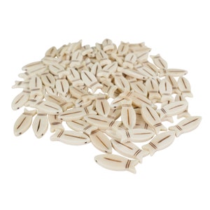 May include: A pile of white bone-like fish shaped beads with brown lines on them.