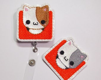 Cat in Orange Box Badge Reel
