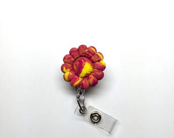 Red and Yellow Flower Badge Reel