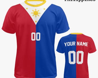 May include: Two short-sleeved t-shirts with a split design featuring the colors of the Philippines flag: red and blue. The front shirt has the number "00" in white, and the text "Philippines". The back shirt has the text "YOUR NAME" and the number "00".