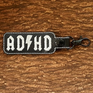 ADHD Classic Rock Metal Keychain, Neurodivergent Label, Autism and ADHD Awareness, Mental Health Key Fob
