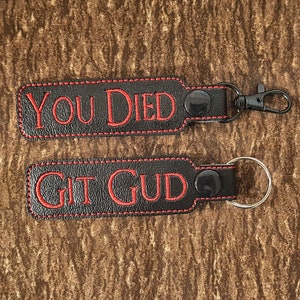 Dark Fantasy You Died/Git Gud Keychain, Video Game Key Fob, Popular Gaming Bag Clip, Perfect Gift for Souls Fans and Gamers