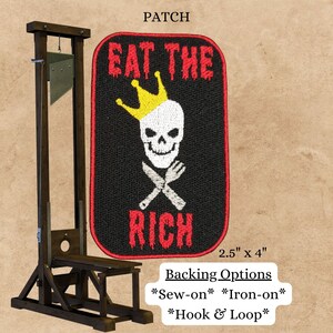May include: An embroidered patch with a black background, red text, and a white skull wearing a gold crown. The text reads "Eat the Rich". The patch is 2.5 inches by 4 inches and has backing options for sewing, ironing, or hook and loop.