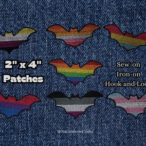 May include: Six 2 inch by 4 inch iron-on, sew-on, or hook and loop patches featuring different pride flags. The flags include the lesbian, bisexual, transgender, non-binary, pansexual, and rainbow pride flags.