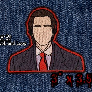 May include: Embroidered iron-on patch featuring a cartoon of a man wearing a suit and headphones. The patch is red with black outlines and measures 3 inches by 3.5 inches. The patch can be sewn on, ironed on, or attached with hook and loop.