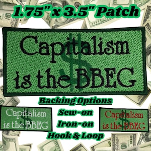 May include: A rectangular green embroidered patch measuring 1.75 inches by 3.5 inches with a black border. The text Capitalism is the BBEG is stitched in black across the center, featuring a subtle dollar sign symbol in the background.