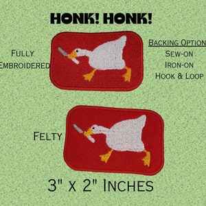May include: Two red rectangular patches with a white goose holding a knife, yellow feet, and the text "HONK! HONK!". One patch is fully embroidered, the other is felty. The patches are 3" x 2" inches and offer sew-on, iron-on, and hook & loop backing options.