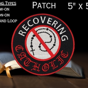 May include: A black and red embroidered patch featuring a red circle with a diagonal line through it. Inside the circle is a white rosary with a cross. The text "RECOVERING CATHOLIC" is written in a gothic font around the circle. The patch measures 5 inches by 5 inches.