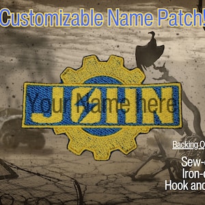 May include: A yellow and blue customizable name patch with a gear design. The patch says "Your Name Here" and has options for sew-on, iron-on, or hook and loop backing.