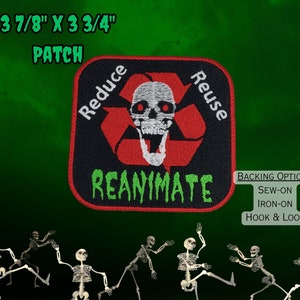 May include: A black and green embroidered patch with a skull and crossbones inside a red recycling symbol. The text "Reduce Reuse Reanimate" is written around the symbol. The patch is 3 7/8 inches by 3 3/4 inches. The backing options are sew-on, iron-on, and hook and loop.