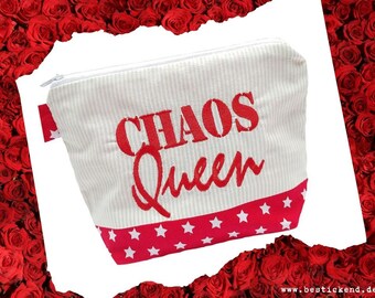 May include: White zippered pouch with red and white striped fabric and a red embroidered design that says "Chaos Queen" with red stars on the bottom.