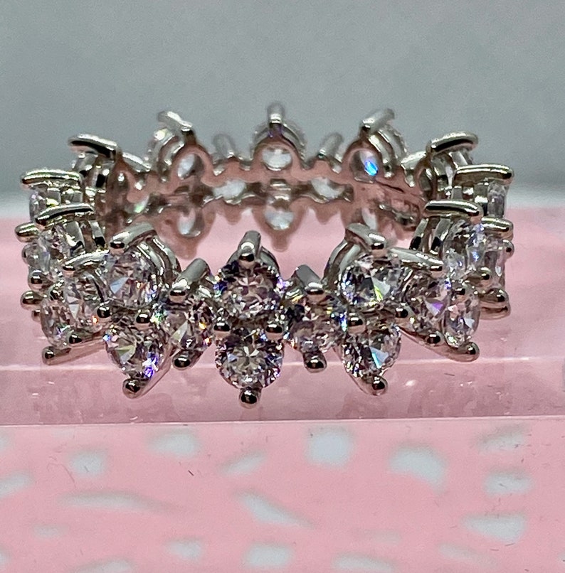 Fancy Round Cut Cubic Zirconia Eternity Band in WGP Sterling Silver