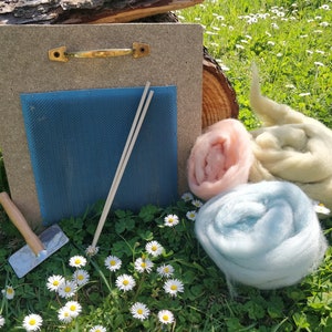 Blending board for fiber mixing colours create rolags to spin. Carding mat for wool with sticks and carder brush, spinning wheel accessories