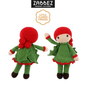 May include: Two crocheted dolls dressed in green and red with holly leaf designs. The dolls have red yarn hair and are wearing red hats. The dolls are part of the "Little Flower Friends" crochet pattern collection.