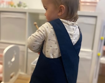 Childrens cross back apron in navy with navy and white striped  lining Sizes or red with red striped lining