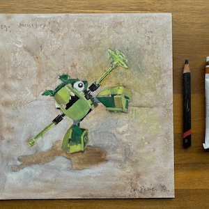 May include: An original painting of a green Lego monster with the text "lego monster!". A black pencil and a tube of yellow ochre oil paint are next to the painting. The painting is approximately 7 inches by 7 inches.