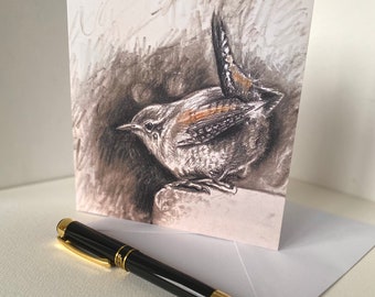 May include: A greeting card featuring a black and white pencil drawing of a wren perched on a rock. The wren has a brown breast and a long tail.