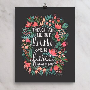 May include: A black and white print with a floral design and the quote "Though she be but little, she is fierce. -Shakespeare".