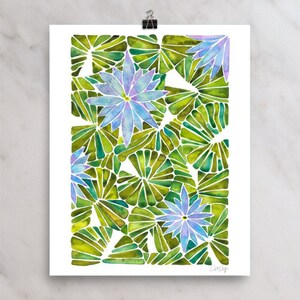 May include: Watercolor painting of a blue and purple flower with green leaves. The flower is in the center of the image and is surrounded by leaves. The leaves are arranged in a pattern that resembles a fan.